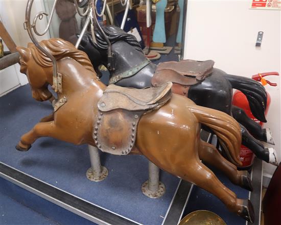 A pair of mid 20th century fibreglass fairground horses W.108cm